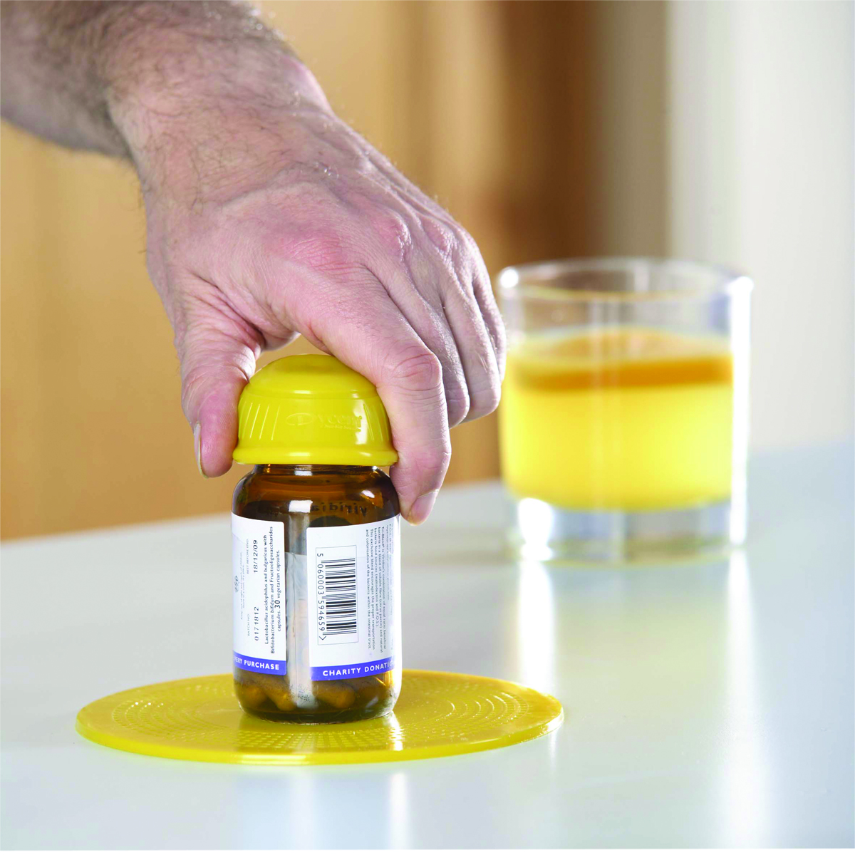 Dycem non-slip cone-shaped bottle opener yellow